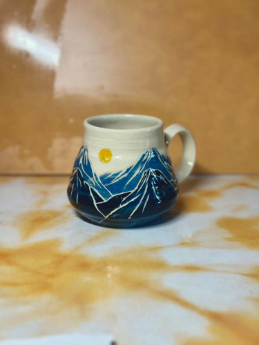 12oz mountain mug with sun